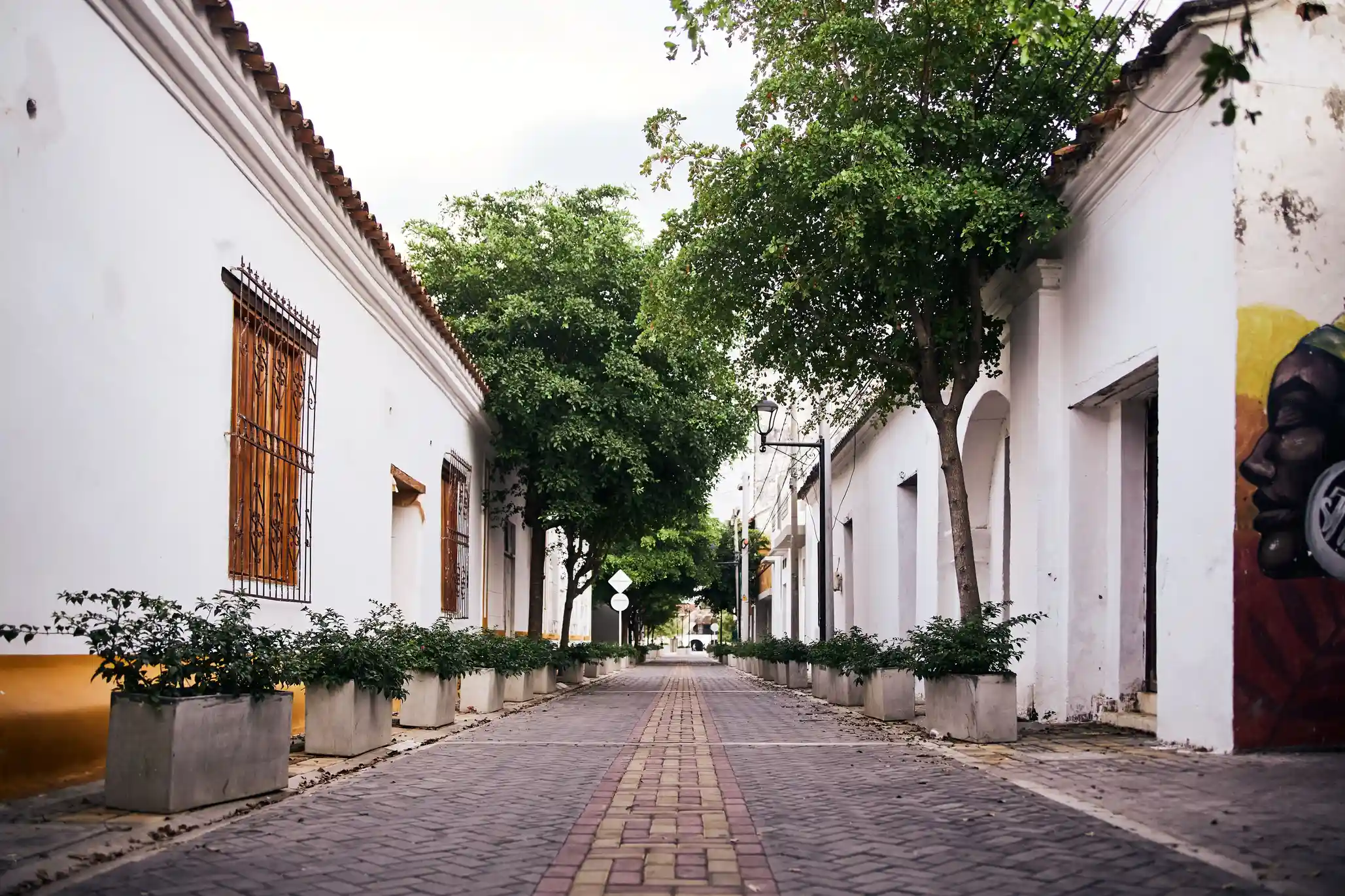 Historic Mexican plaza beneath a dramatic sky